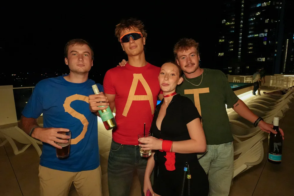 Halloween party guests by the pool